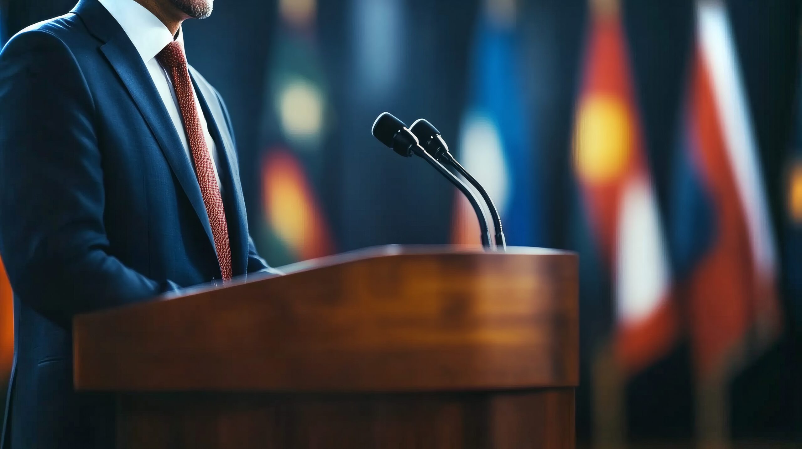 Speaker presenting confidently at podium