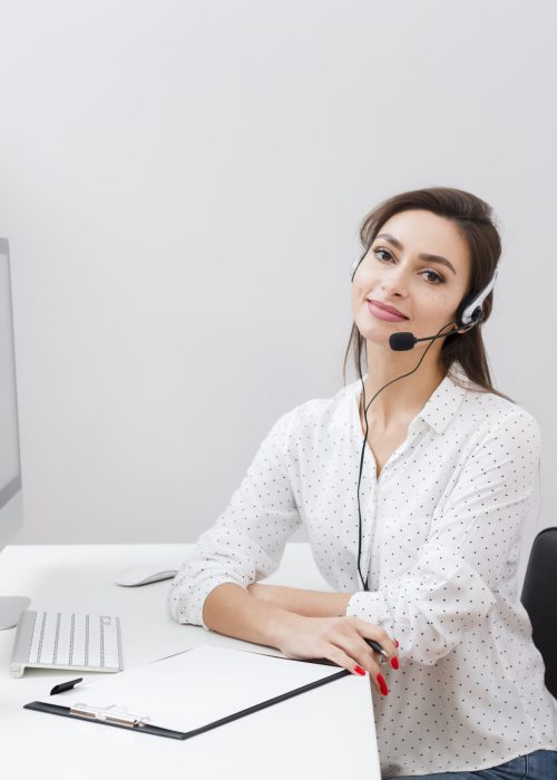 charming-woman-desk-wearing-headset
